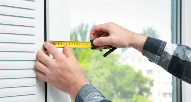 Foundation inspection. Image shows measurements being taken on a window.